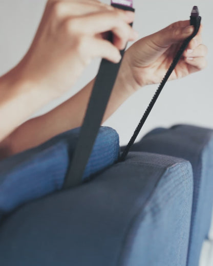 securing Seat Straps around plane head rest to keep pillow in place